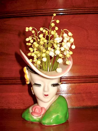 Vaso antico in porcellana policroma.Busto di donna