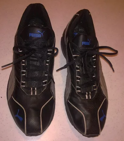 Scarpe da ginnastica Puma misura 46 in morbida pelle nera e