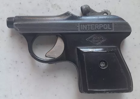 Pistola giocattolo in metallo con scritta INTERPOL Italia